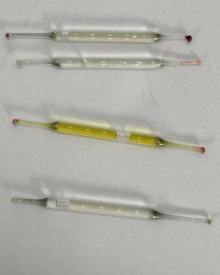 What are these? Found under a bathroom cabinet during renovations – small glass tubes, 5 cm long, filled with liquid. Any ideas?